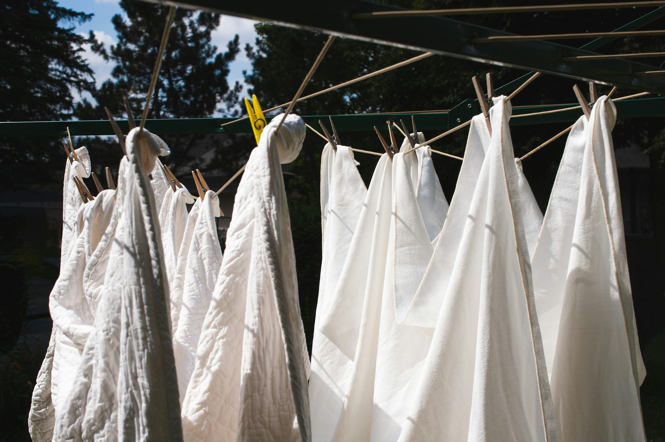 White laundry drying in sunlight